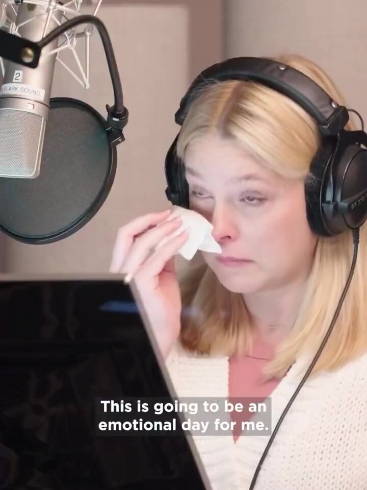 Briana White, the English voice of Aerith, wipes a tear with a tissue in a recording booth, captioned This is going to be an emotional day for me, a frame from Square Enix's Behind the Booth video. Image: Square Enix
