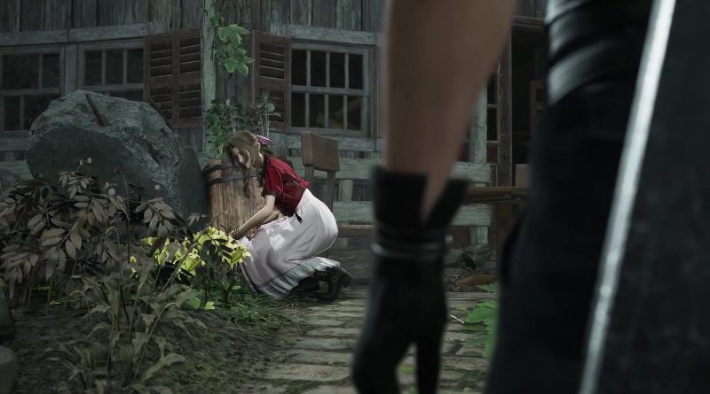 Aerith kneels among glowing yellow flowers in her garden as Cloud stands in the foreground, a frame from Square Enix's Final Fantasy VII Revelation release date trailer. Image: Square Enix
