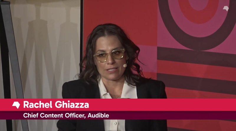 Rachel Ghiazza, Audible's chief content officer, speaking on stage at the Frankfurt Book Fair on 9 October 2026, with her name caption on screen, a frame from the fair's session video. Image: Frankfurter Buchmesse
