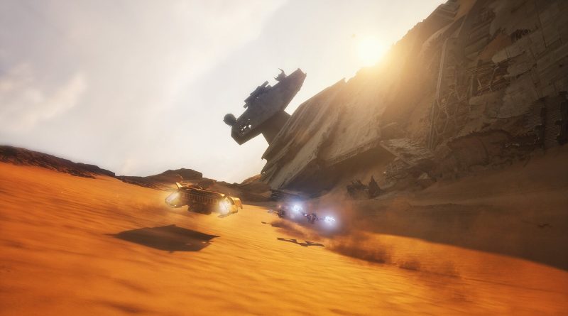 Captura oficial de Star Wars: Galactic Racer: deslizadores corren sobre arena naranja junto a un Destructor Estelar estrellado en Jakku. Imagen: Secret Mode y Fuse Games