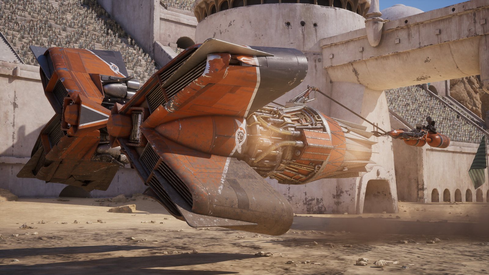 Official screenshot from Star Wars: Galactic Racer: an orange podracer with twin engines skims across the sandy floor of a stone arena. Image: Secret Mode and Fuse Games