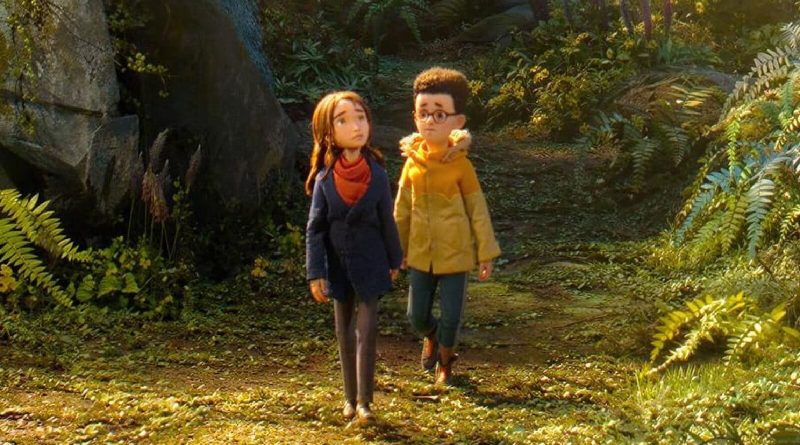 Still from Laika's Wildwood: Prue and Curtis, two stop-motion puppet children, walk side by side along a sunlit forest path among ferns. Image: LAIKA