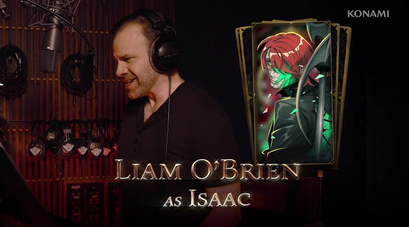 Liam O'Brien recording lines in a booth beside the Isaac character card, from Konami's English voice cast trailer for Castlevania: Belmont's Curse. Image: Konami