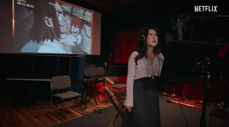Voice actor Rosalie Chiang records an English dub of the anime Sakamoto Days in a studio, with the scene projected behind her. Image: Netflix