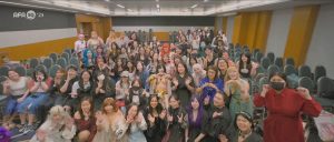 Fans wave and make heart shapes for the camera in a meeting room at the Suntec convention centre during AFA Singapore 2025. Image: Anime Festival Asia