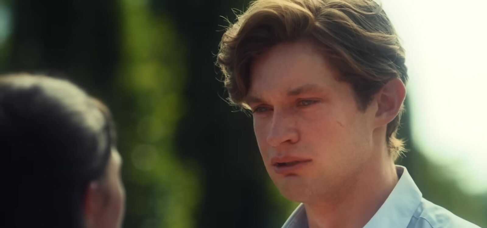 Close-up of James, played by Damian Hardung, speaking to Ruby in a sunlit garden, from the official Maxton Hall Season 2 trailer, which carries the original German dialogue. Image: Prime Video