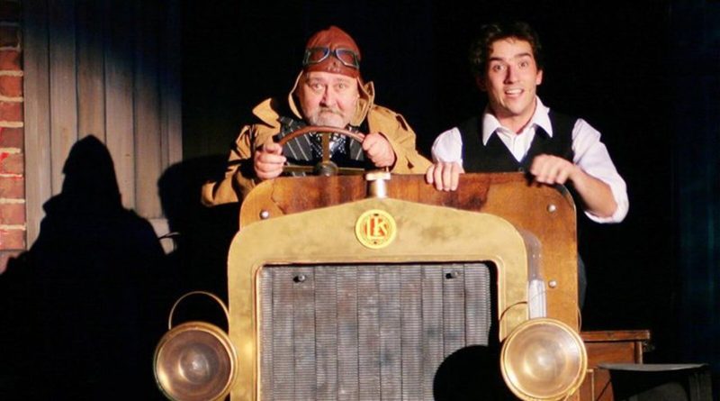Ota Jirák at the wheel of a vintage car on stage, with Matouš Ruml, in Dědeček automobil at the Municipal Theatre in Mladá Boleslav. Photo: Michal Škvor, Městské divadlo Mladá Boleslav, CC BY-SA 3.0